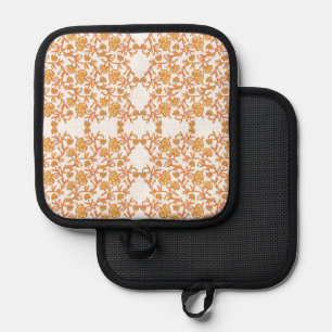 an orange and white wallpaper with a floral design pot holder