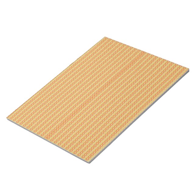 an orange and yellow background with small dots notepad (Angled)