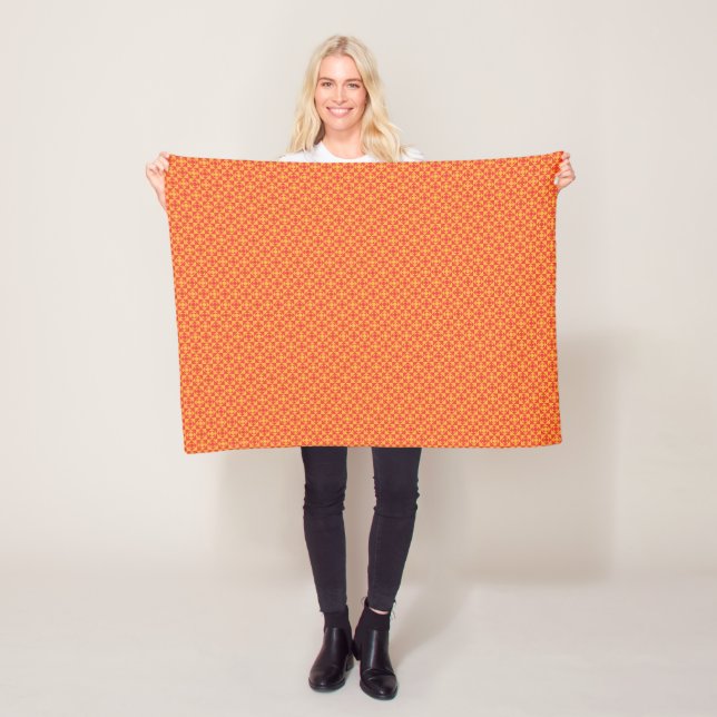 an orange and yellow background with small squares fleece blanket (In Situ)