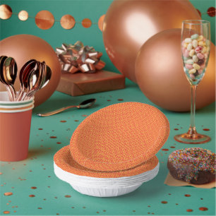 an orange and yellow background with small squares paper plate