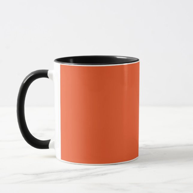 an orange background with a black border mug (Left)