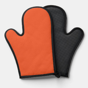 an orange background with a black border oven mitt