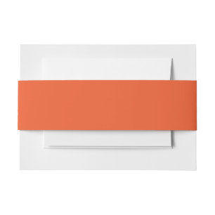 an orange background with a invitation belly band