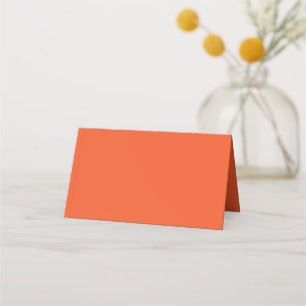 an orange background with a place card