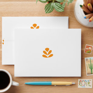 an orange flower on a white background envelope