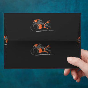 an orange motorcycle with a black background envelope