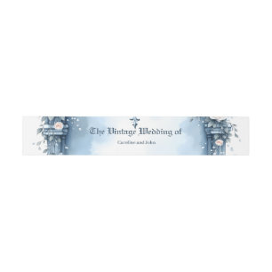 An ornate light blue archway with floral accents, invitation belly band
