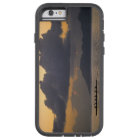 An outrigger canoe team practices off the coast