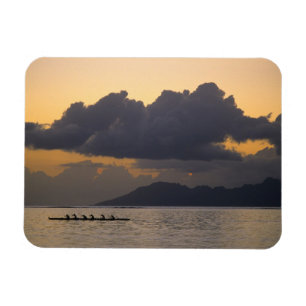 An outrigger canoe team practices off the coast magnet