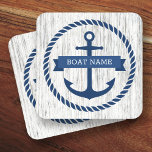 Anchor rope border boat name driftwood background coaster<br><div class="desc">Coasters featuring a dark blue nautical anchor surrounded by a rope border on a light grey driftwood background. Across the anchor is a blue ribbon with a template field for your boat's name or other custom text.</div>