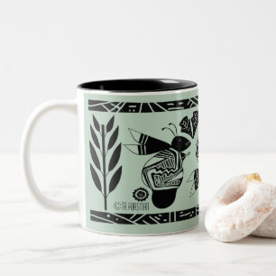 Ancient bees and flowers on gold mug