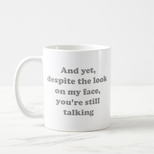 And Yet Despite The Look On My Face Coffee Mug (Left)
