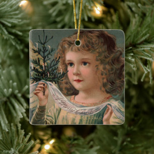 Angel Holding a Tiny Candlelit Christmas Tree Ceramic Ornament