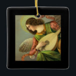 Angel Painting With Mandolin  Ceramic Ornament<br><div class="desc">beautiful renascence style vintage painting of an angel with brown curly hair, wings, halo, shiny pink ribbon, wearing a lovely pink shirt, lovely green dress with gold collar, and beautiful graceful hands with fingers strumming a mandolin placed on her lap, and she seems to be standing above and looking out...</div>