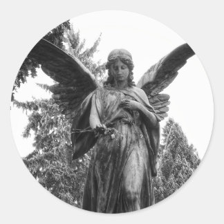Angel With Spread Wings Holding A Flower Classic Round Sticker