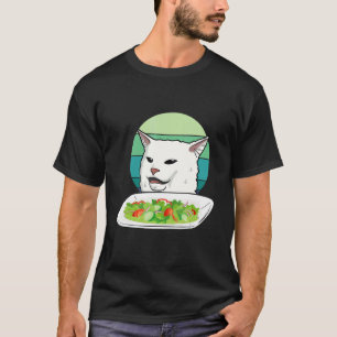 Angry women yelling at confused cat at dinner tabl T-Shirt