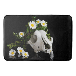Animal skull with a wreath of wild flower bath mat