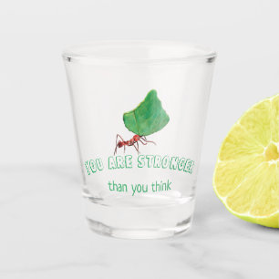 Ant carrying a big leaf shot glass