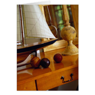 Antique Baseballs On A Table By A Model Sailboat