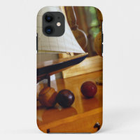 Antique Baseballs On A Table By A Model Sailboat