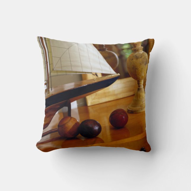 Antique Baseballs On A Table By A Model Sailboat Cushion (Front)