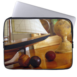 Antique Baseballs On A Table By A Model Sailboat Laptop Sleeve