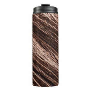 Antique brown obsolete wooden background. age-old, thermal tumbler