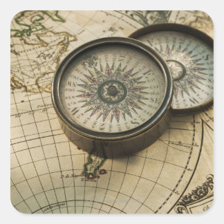 Antique compass on map square sticker