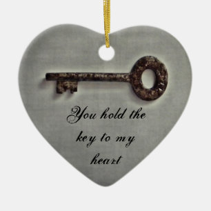 Antique key on grey ceramic tree decoration