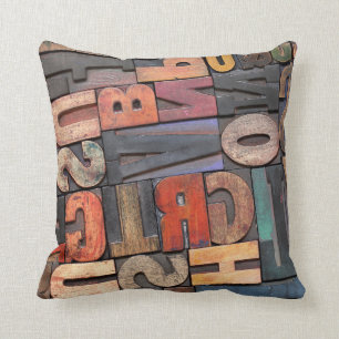 antique letterpress ing blocks with color ink pati cushion