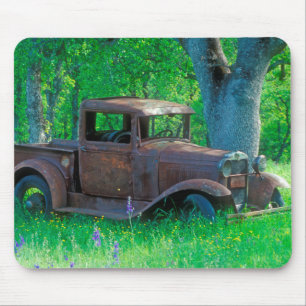 Antique rusted truck in a meadow mouse pad