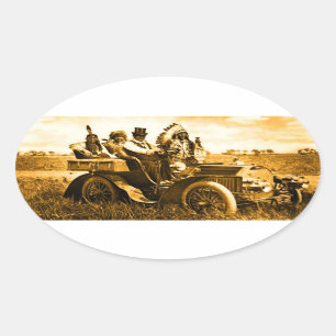 APACHES AND GERONIMO DRIVING A MOTOR CAR OVAL STICKER