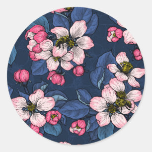 Apple blossom on a dark blue classic round sticker