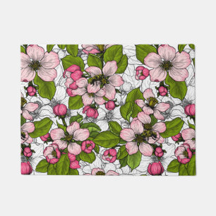 Apple blossom on white doormat