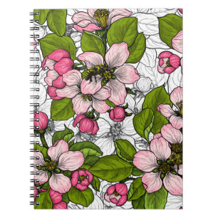 Apple blossom on white notebook