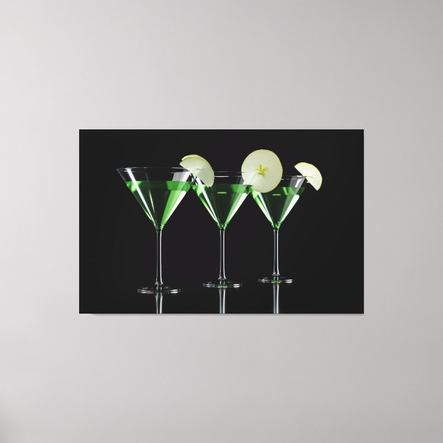 Apple cocktails in martini glasses on black canvas print (Front)