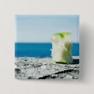 Apple core in the dirt 15 cm square badge