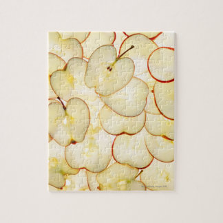 apple slices backlit and arranged in abstract jigsaw puzzle