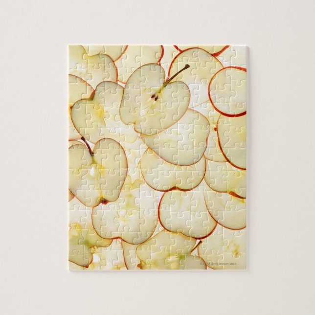 apple slices backlit and arranged in abstract jigsaw puzzle (Vertical)