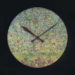 Apple Tree by Gustav Klimt, Vintage Art Nouveau Round Clock<br><div class="desc">Apple Tree (1912) by Gustav Klimt is a vintage Victorian Era Symbolism fine art painting. A nature scene with an apple tree in an orchard on a farm with ripe fruit and apple blossoms. The floral garden is in full bloom with spring flowers. About the artist: Gustav Klimt (1862-1918) was...</div>