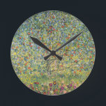 Apple Tree by Gustav Klimt, Vintage Art Nouveau Round Clock<br><div class="desc">Apple Tree (1912) by Gustav Klimt is a vintage Victorian Era Symbolism fine art painting. A nature scene with an apple tree in an orchard on a farm with ripe fruit and apple blossoms. The floral garden is in full bloom with spring flowers. About the artist: Gustav Klimt (1862-1918) was...</div>