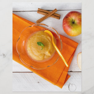 Applesauce with cinnamon and orange spoon