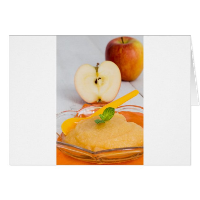 Applesauce with cinnamon and orange spoon (Front Horizontal)