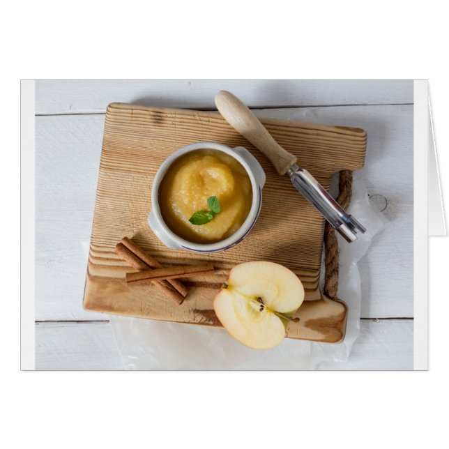 Applesauce with cinnamon in stoneware bowl (Front Horizontal)