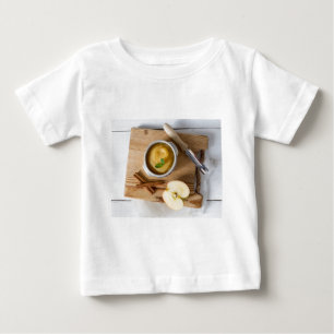 Applesauce with cinnamon in stoneware bowl baby T-Shirt