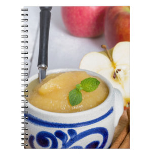 Applesauce with cinnamon in stoneware bowl spiral notebook