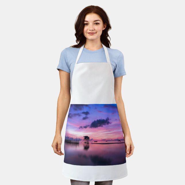 Aprons with image of peaceful lagoon in late after (Worn)