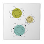 Aqua Blue and Yellow Atomic Elements Midcentury Tile<br><div class="desc">This fabulous mid century modern ceramic tile features 3 atomic element shapes in the colours of aqua blue, avocado green, yellow, and black. This makes a fabulous addition to your kitchen or bathroom.</div>
