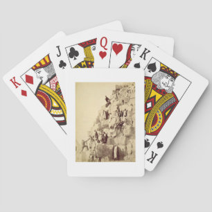 Arabs assisting tourists to climb the pyramids at playing cards