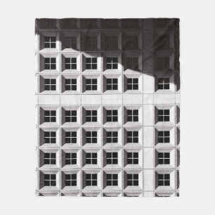 ARCHITECTURAL PHOTOGRAPHY OF WHITE BUILDING FLEECE BLANKET